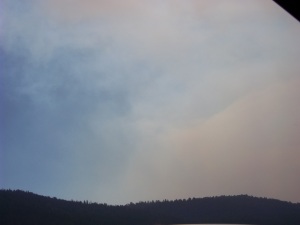 Smoke from the fire on the other side of the mountain range. 